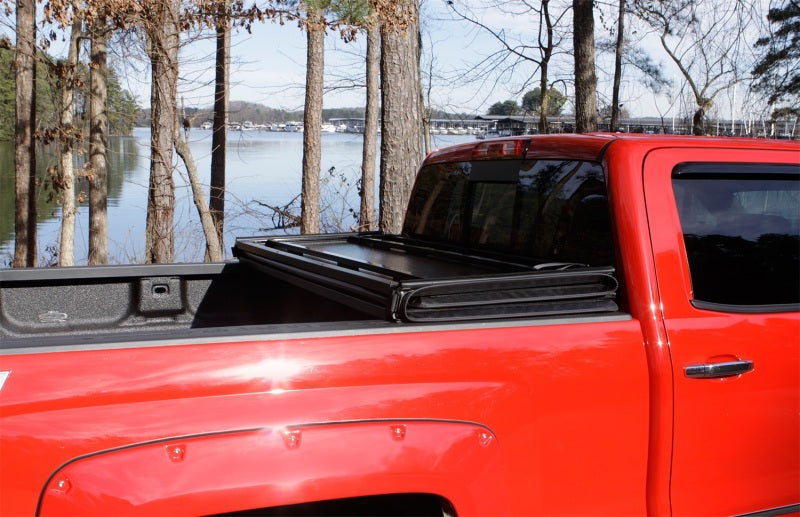 Lund 99-17 Ford F-250 Super Duty Styleside (8ft. Bed) Hard Fold Tonneau Cover - Black